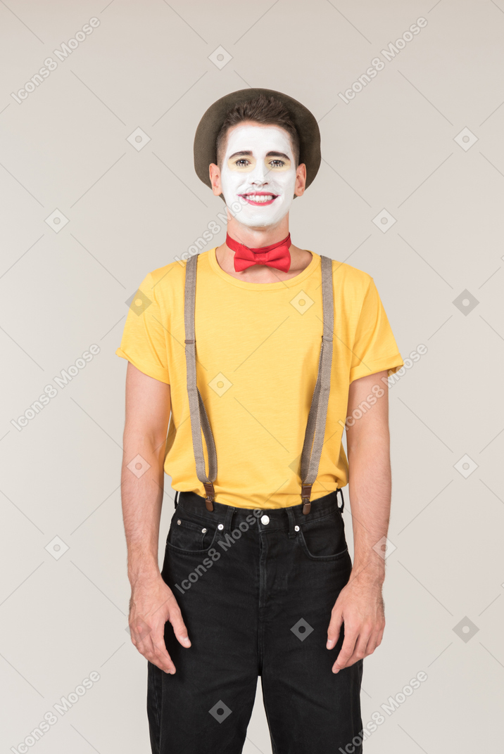 Smiling male clown looking right into the camera