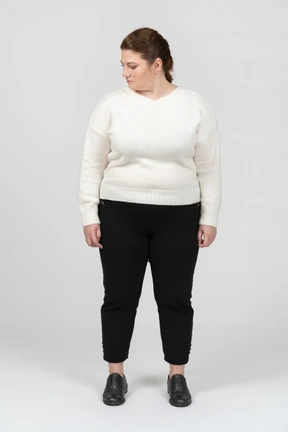 Plump woman in casual clothes standing