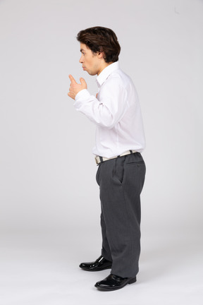 Side view of young man gesturing