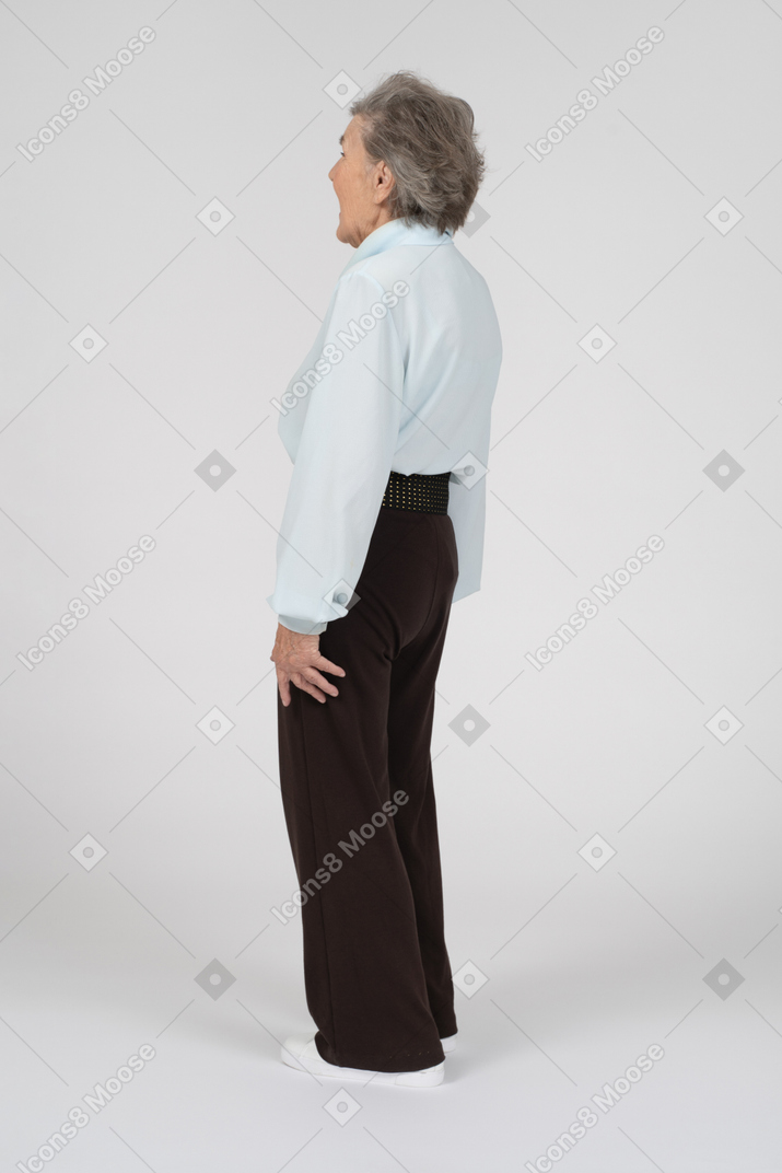 Rear view of an old woman gaping