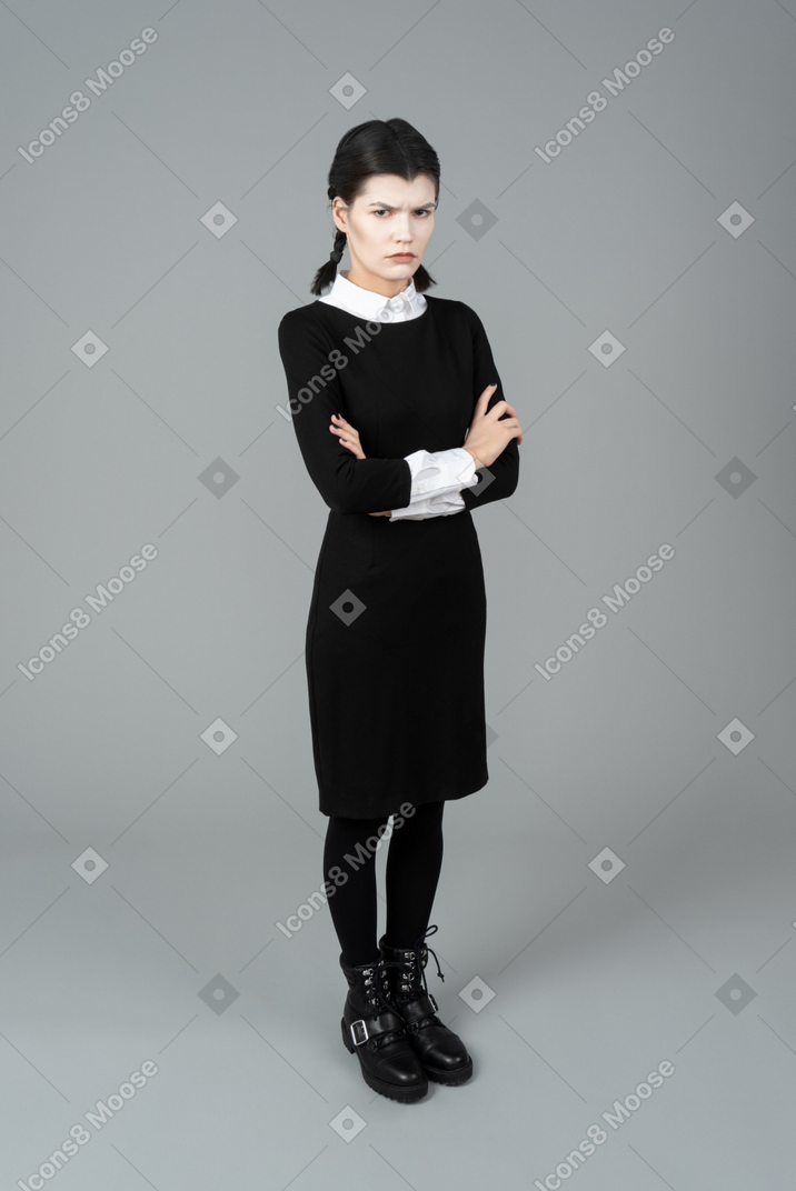 Young woman in wednesday addams costume