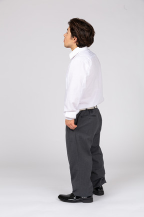 Side view of man in office clothes looking up