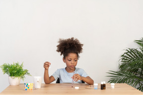 Good looking cute girl doing science at the table