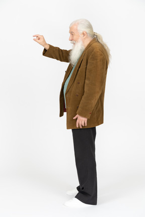 Side view of an old man showing the size of something