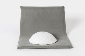 White kippah on grey background