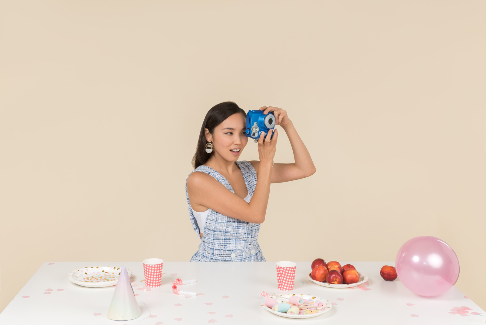 Young asian woman celebrating birthday and making a photo