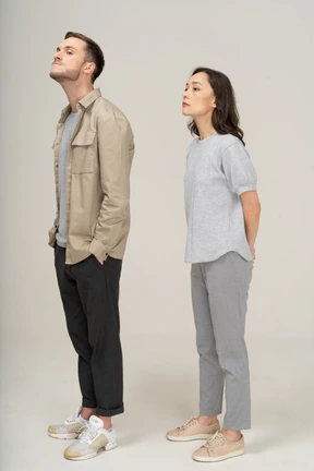 Three-quarter view of young couple pulling their neck
