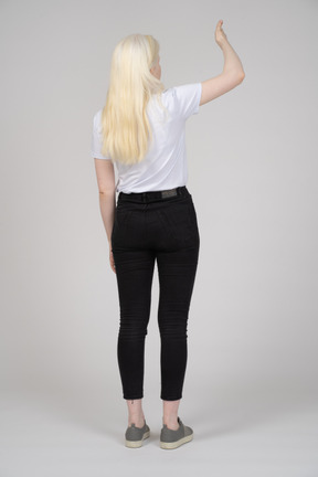 Back view of girl gesturing