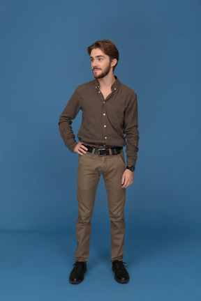 A slim young man standing