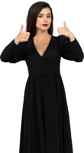 Vue frontale, de, a, jeune femme, dans, a, robe noire, projection, pouces haut