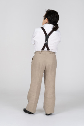 Back view of man wearing suspenders