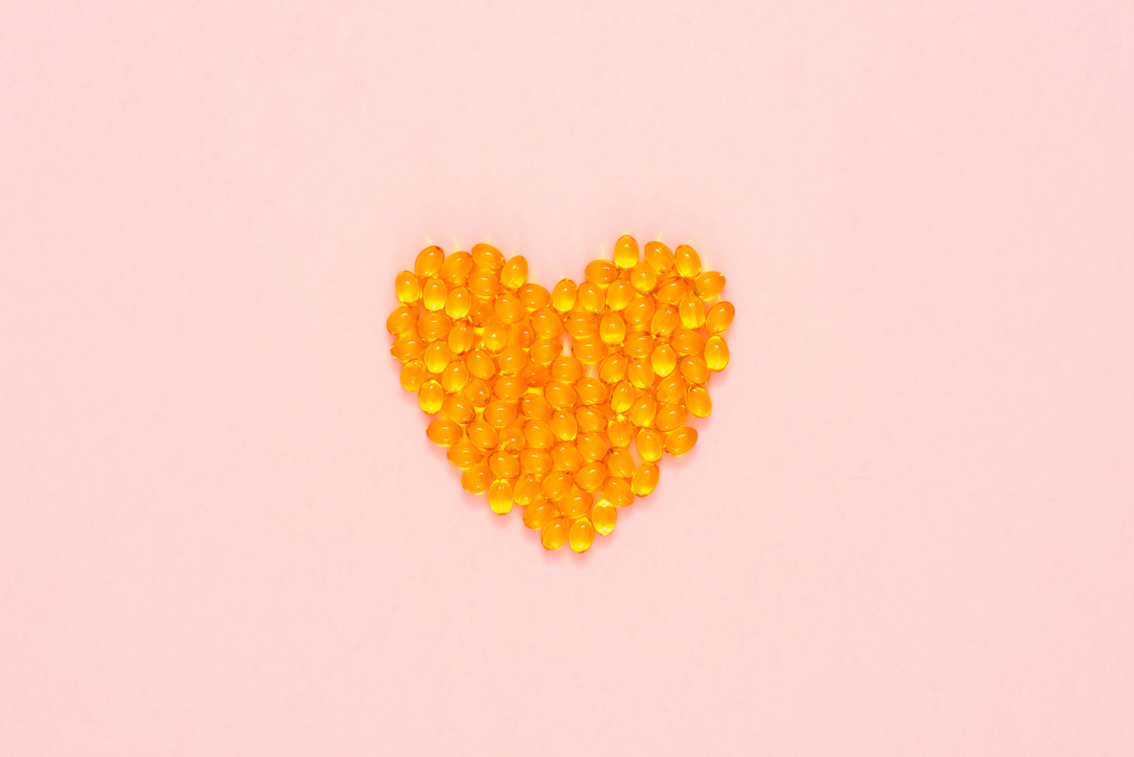 Yellow pills arranged in a shape of heart