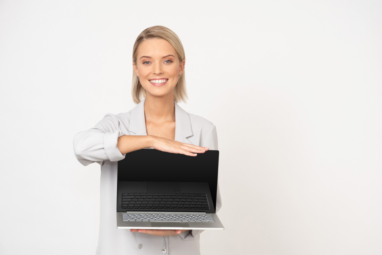 Young businesswoman showing her laptop