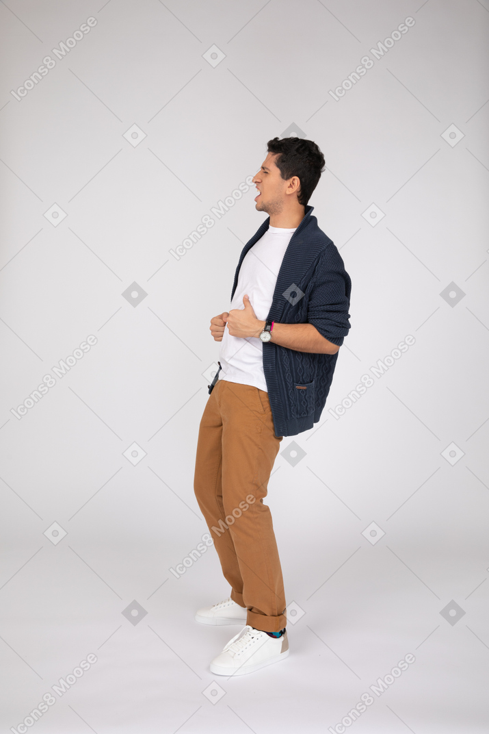 Side view of shouting man leaning backwards