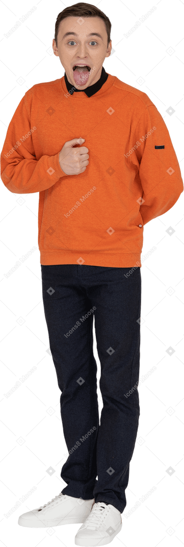 Young man in orange sweatshirt standing