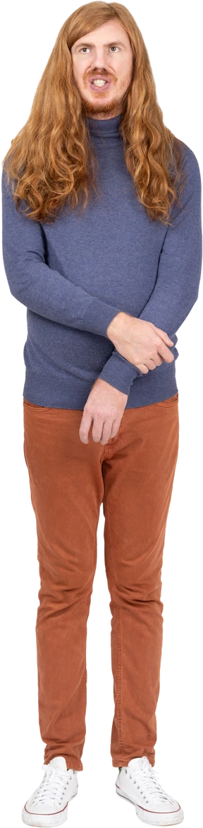 Front view of a young man in casual clothes standing with crossed arms
