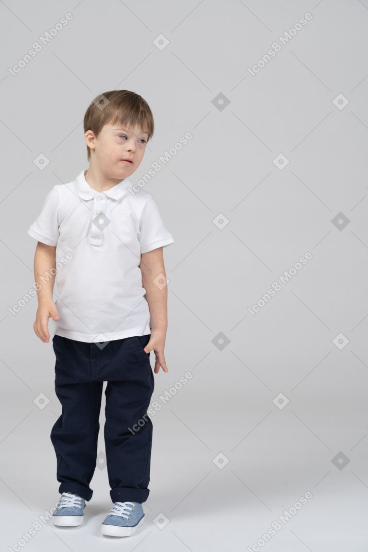 Front view of little boy looking aside