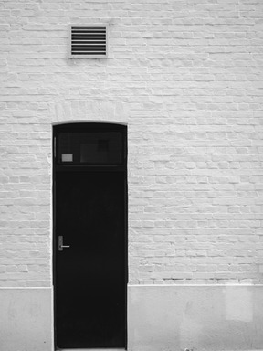 White wall and black door