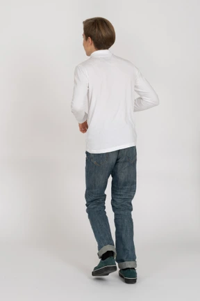 Young man in casual clothes standing