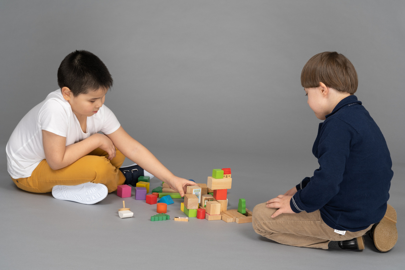 Kids playing with toy blocks