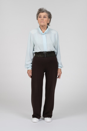 Old woman standing with side look