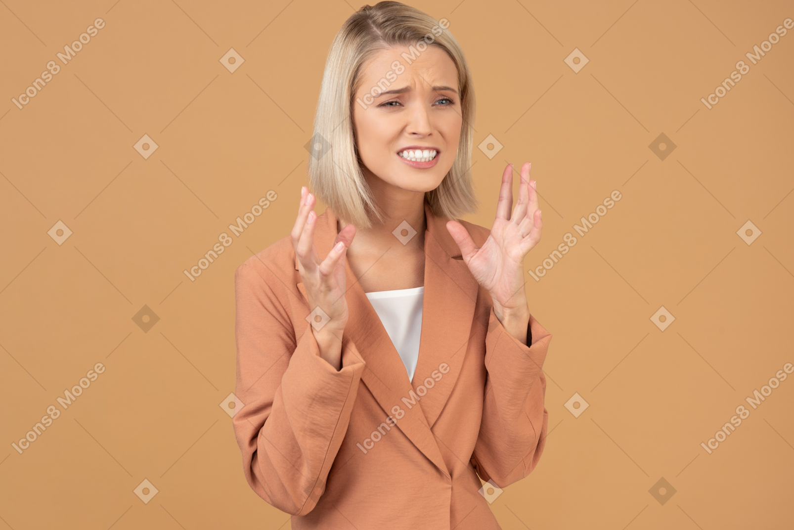 Upset young woman with raised hands