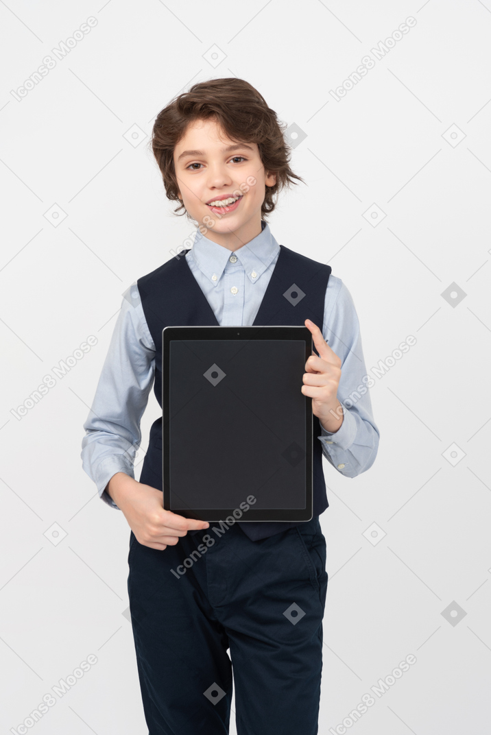 Schoolboy showing his digital tablet