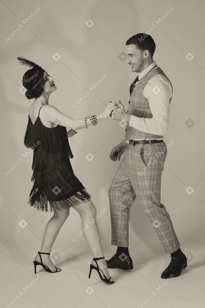 Retro-styled couple dancing to the tune