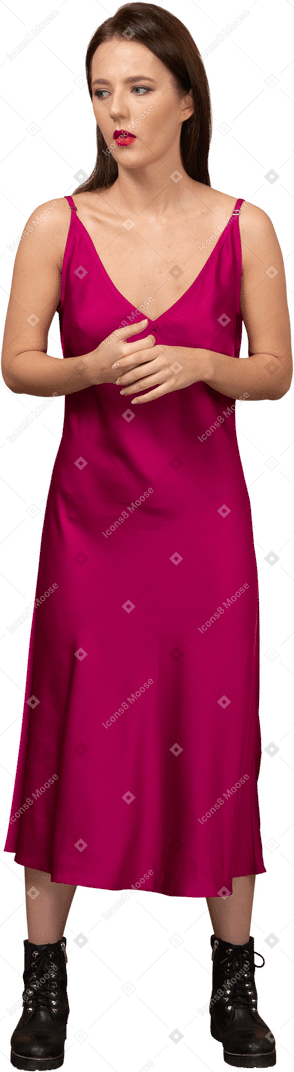 Front view of a beautiful young woman in red dress