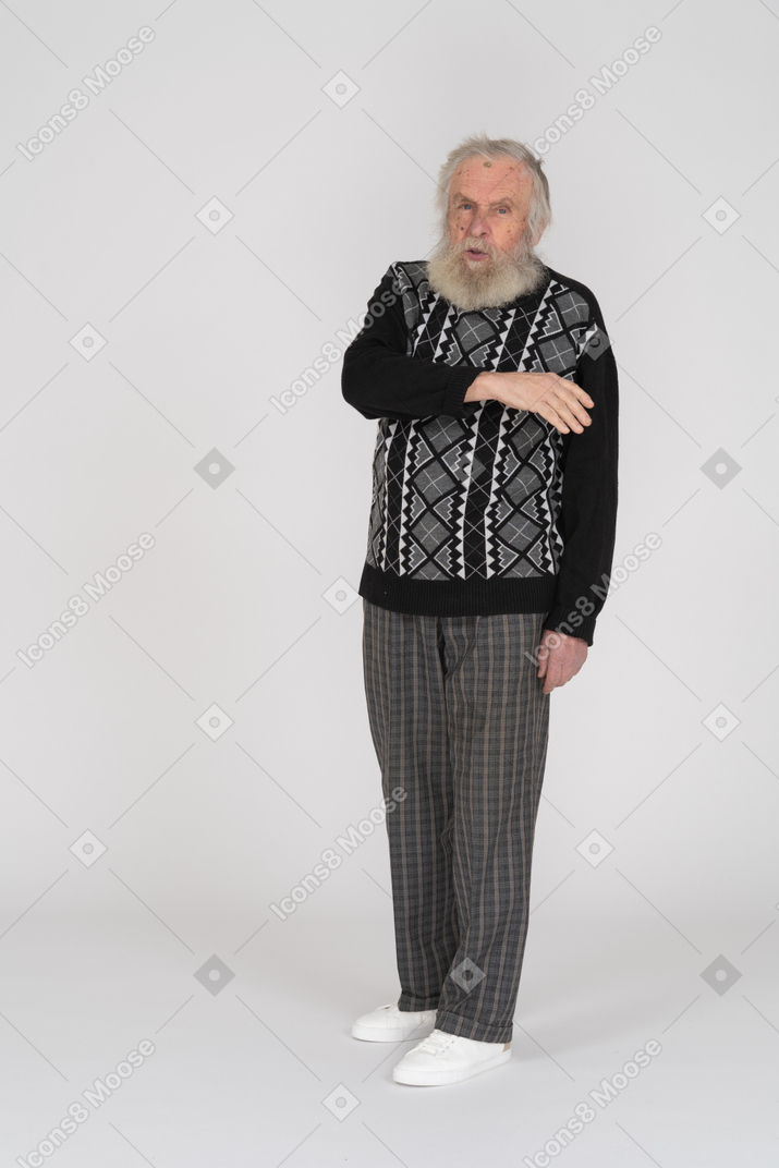 Elderly man bending his arm
