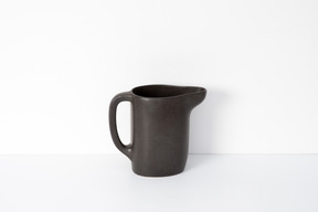 Brown ceramic mug with spout
