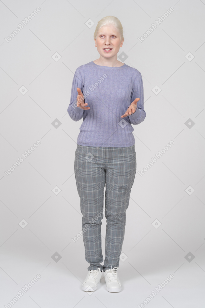 Young woman gesturing and explaining something