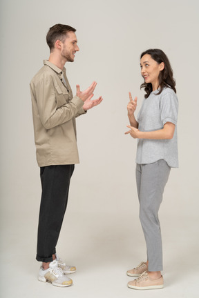 Side view of young couple speaking to each other