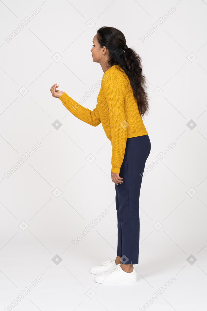 Side view of a girl in casual clothes explaining something