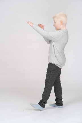 Little boy standing in defending position