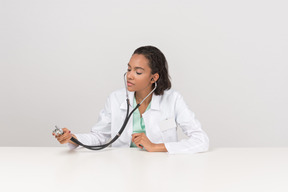 Beautiful female doctor with the stethoscope