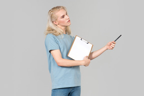 Dreamy young activist guy holding folder and pen