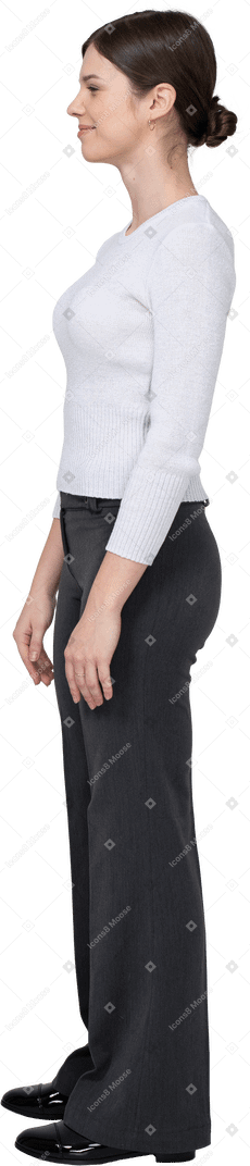 Side view of a suspicious young woman in office clothing