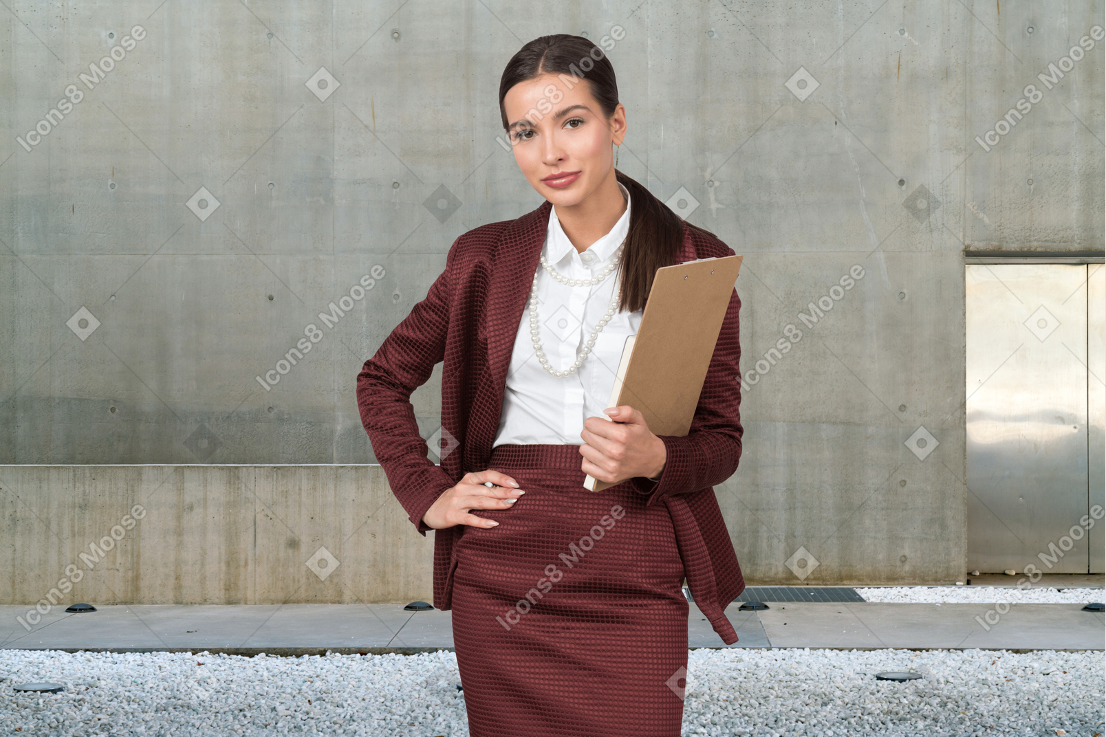 Female real estate agent holding folder