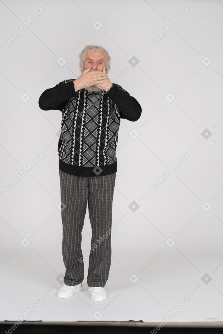 Old man covering mouth with hands