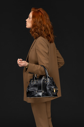 Side view of a businesswoman with handbag