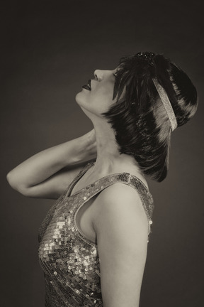 Brunette woman looking up in the dark