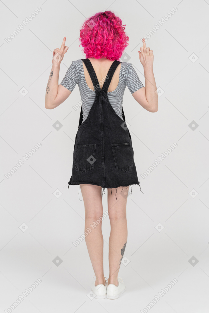 A pink haired girl making a rude gesture