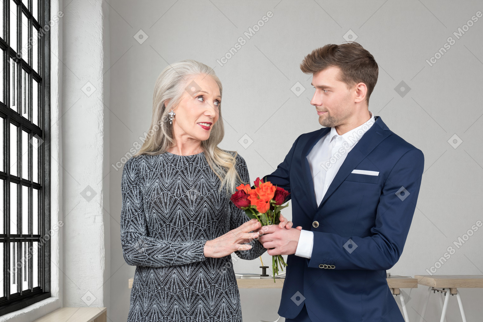 Guy giving a flower bouquet