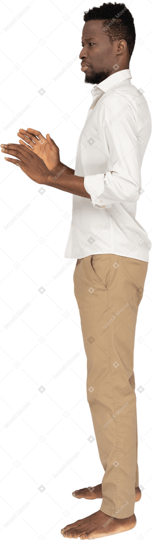 Man in white shirt standing