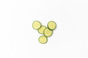 Cucumber slices on white background