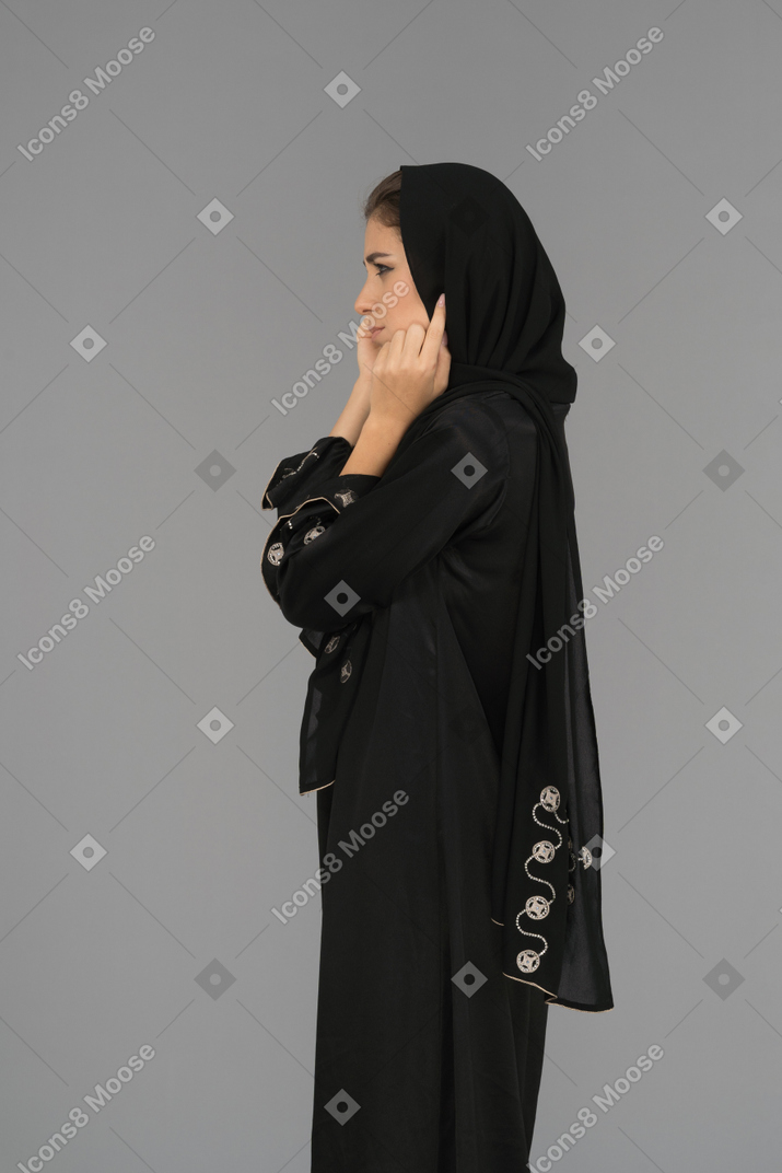 A thoughtful muslim woman