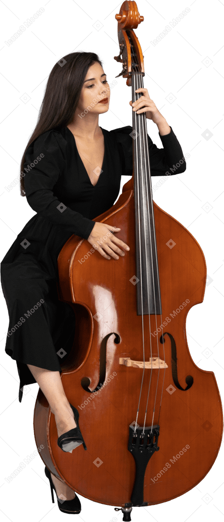Front view of a young woman in black dress playing her double-bass putting leg on it