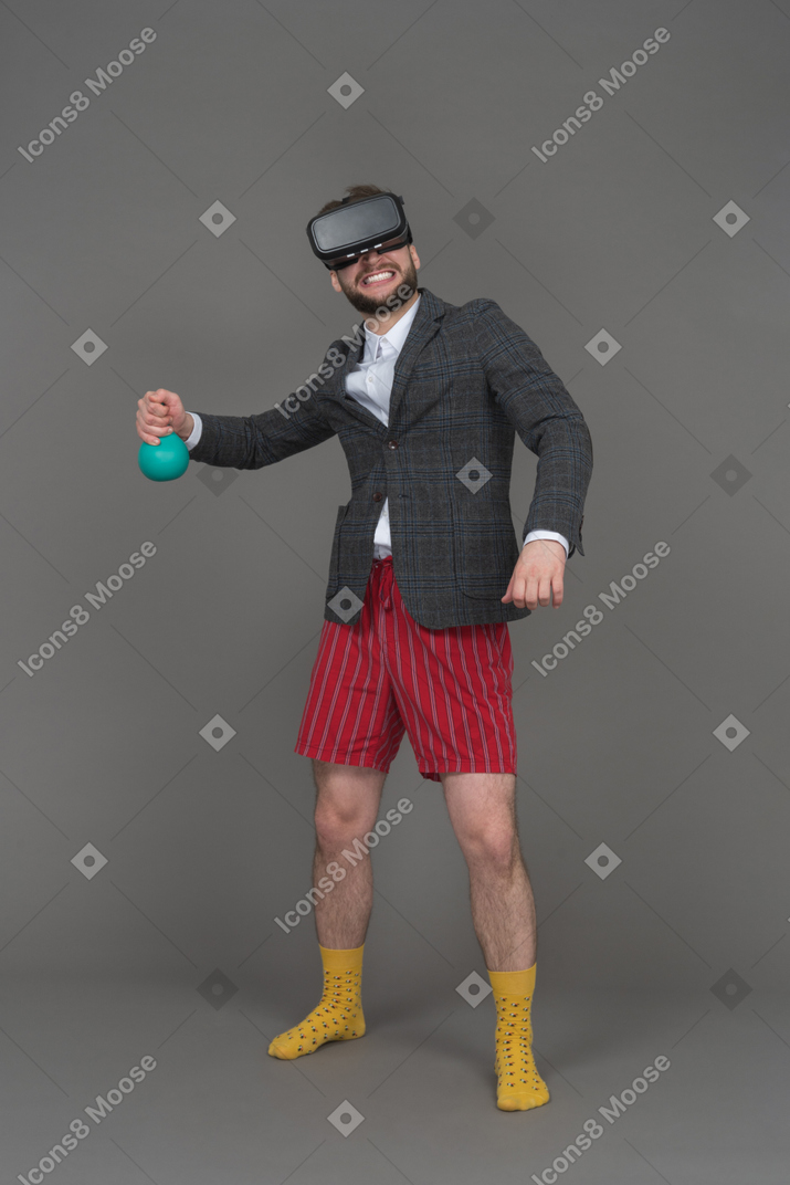 Man in vr headset holding object
