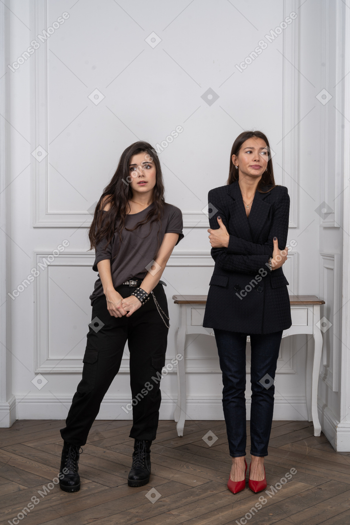 Two women looking uncomfortable